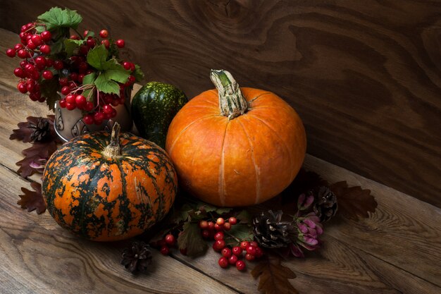 Fall table centerpiece with viburnum and pumpkins