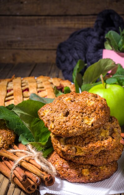 Fall traditional baking, homemade apple cake and apple pie oatmeal cinnamon cookies, halloween thanksgiving, autumn baking food, cozy baking wooden background copy space