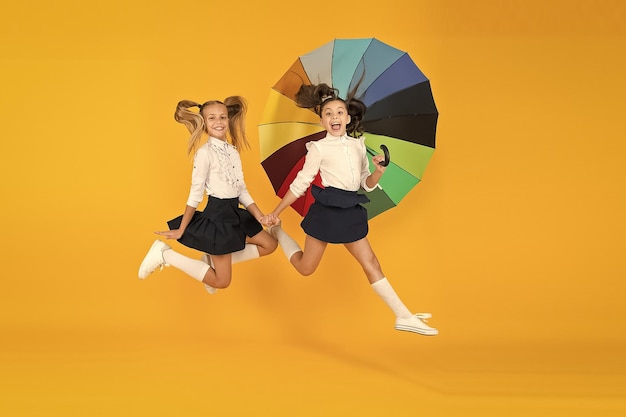 Fall weather forecast place for both of us fashion accessory girls friends with umbrella rainy day happy childhood school time rainbow umbrella colorful life schoolgirls happy big umbrella