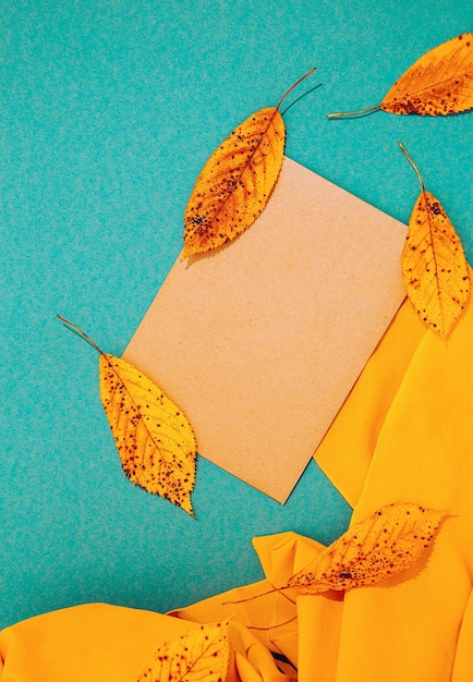 Fall Winter background Autumn leaf and yellow textile Trendy colors shades Seasonal stylish minimalist mockup wallpaper