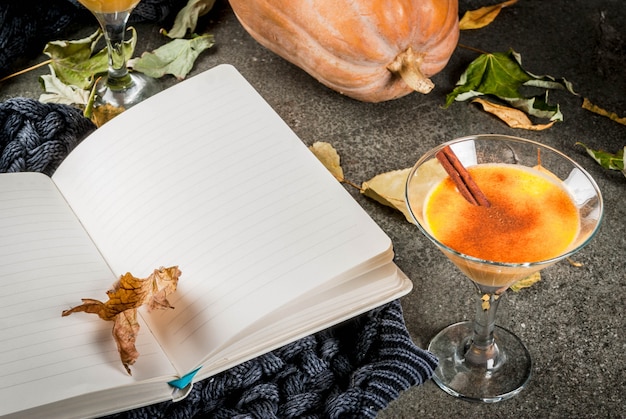 Fall and winter drinks. Thanksgiving and Halloween cocktails. Pumpkin pie margarita with cinnamon stick, .