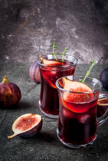Fall and winter red sangria cocktail with thyme and figs