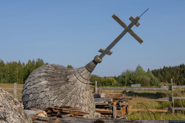 Fallen Christian cross on the dome of the church