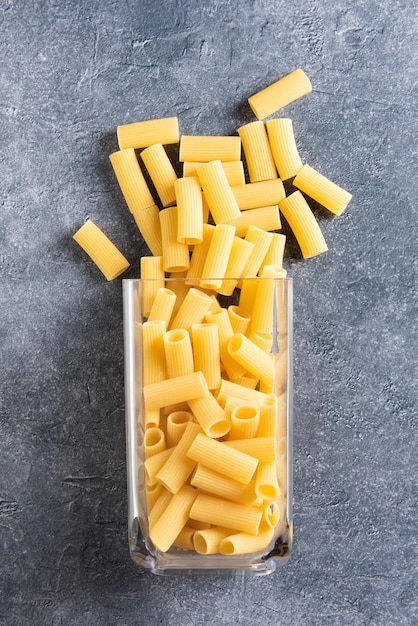 Fallen container full of rigatoni pasta.