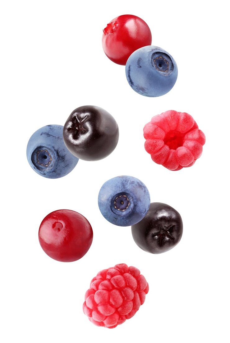 Photo falling blueberries, chokeberries, raspberries and cranberries