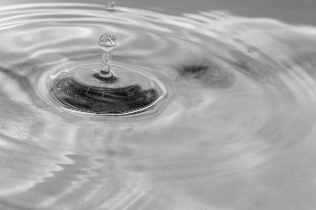 Falling drops in water