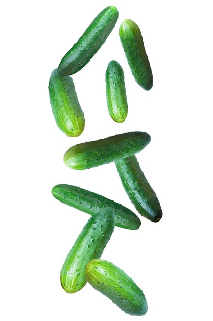 Photo falling fresh cucumbers isolated on white background