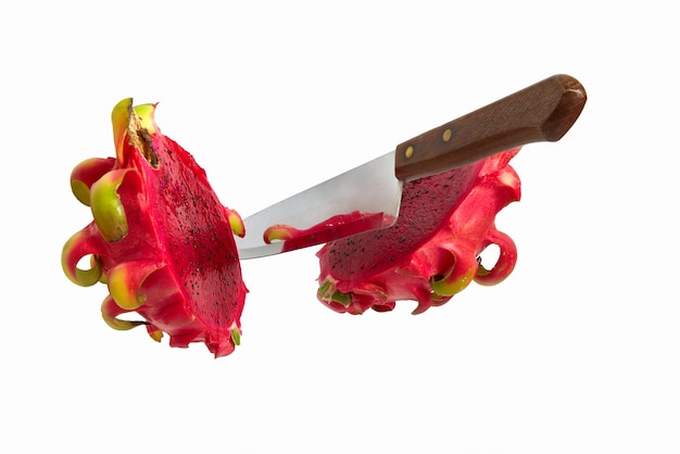 Falling knife cut pattaya fruits isolated on white. Exotic tropical dragon fruit