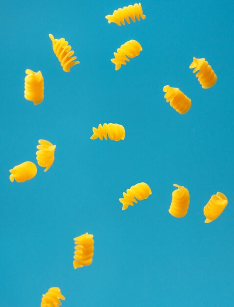 Falling pasta on a blue background