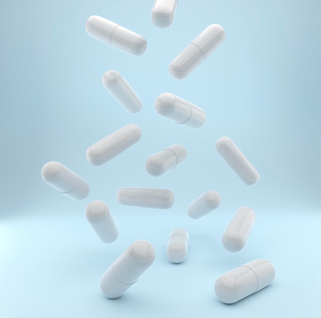 Falling pills on a light blue background