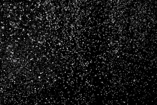 Falling Snow down On The Black Background