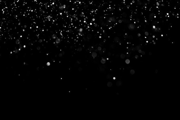 Photo falling snow isolated on black background