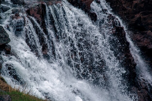 Falling streams of water from the waterfall