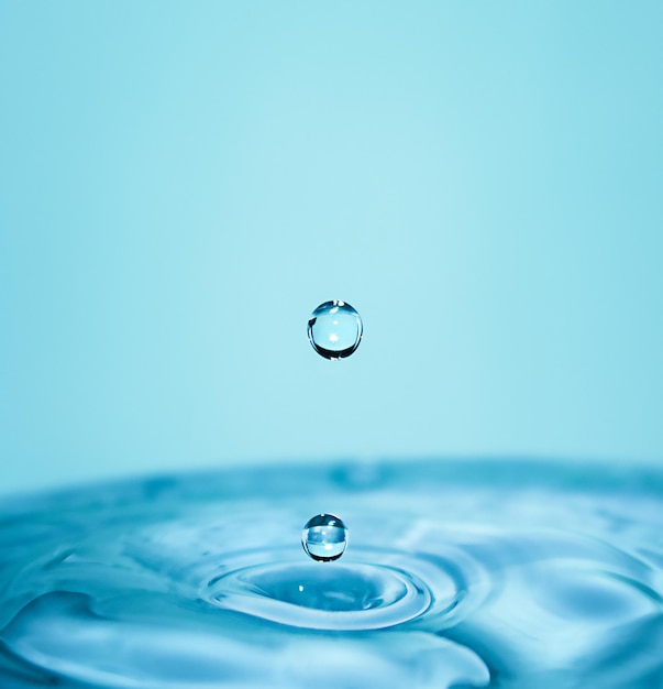 Falling water drops in macro Vertical photography