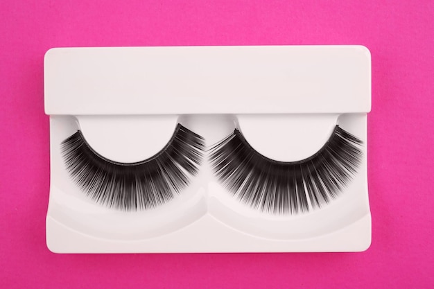 False eyelashes on color background