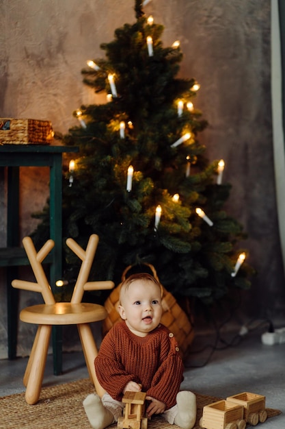 Families Portrait Of Happy Young Mother And Father with Child Posing In home Interior