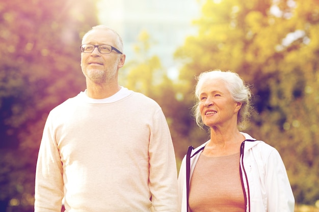 family, age, tourism, travel and people concept - senior couple in city park