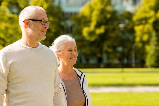 family, age, tourism, travel and people concept - senior couple in city park