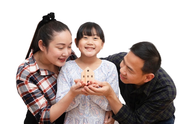 family Asian happy hand holding mini wood house model from model on wood table, Planning buy Real Estate, Planning to buy property. concept of Choose the best.