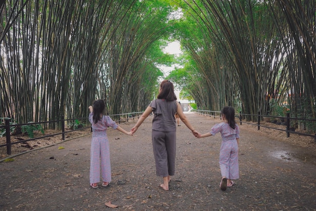 Photo family in bamboo tunnel of wat chulabhorn wanaram temple