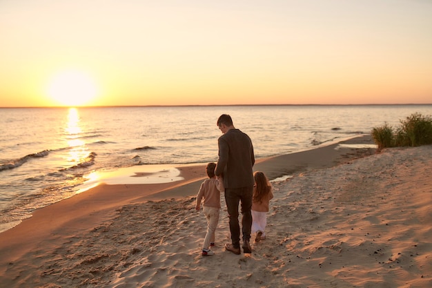 Family on the beach in autumn