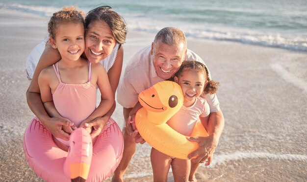 Family beach and portrait of grandparents with multiracial kids bond on Mexico holiday in summer Retirement grandma and grandpa enjoy caring hug with foster and adoption grandchildren in water