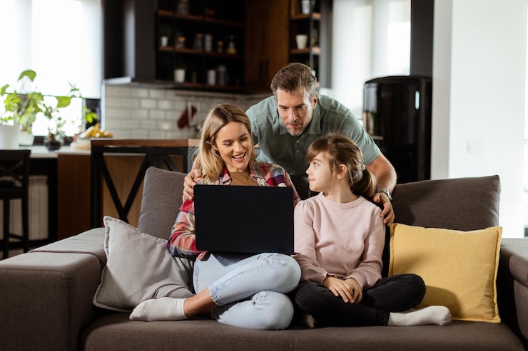 Photo family bonding time with laptop in cozy home setting