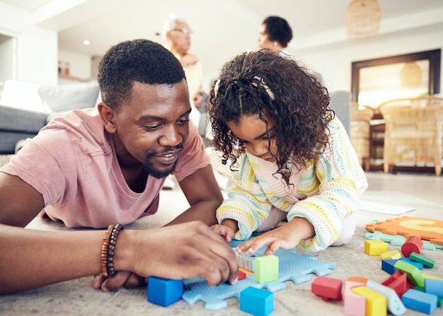 family building blocks and dad with girl on floor in living room for playing bonding and quality time love educational toys and happy father with child with toys relaxing and creative activity