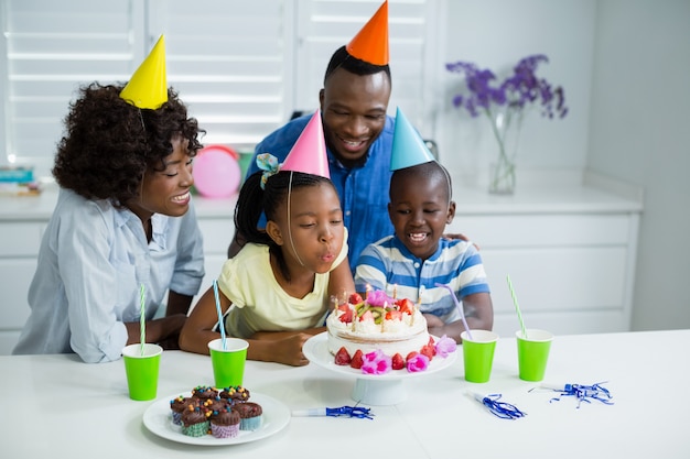 Family celebrating birthday party at home