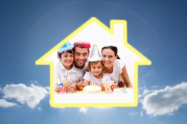 Family celebrating daughter against cloudy sky with sunshine