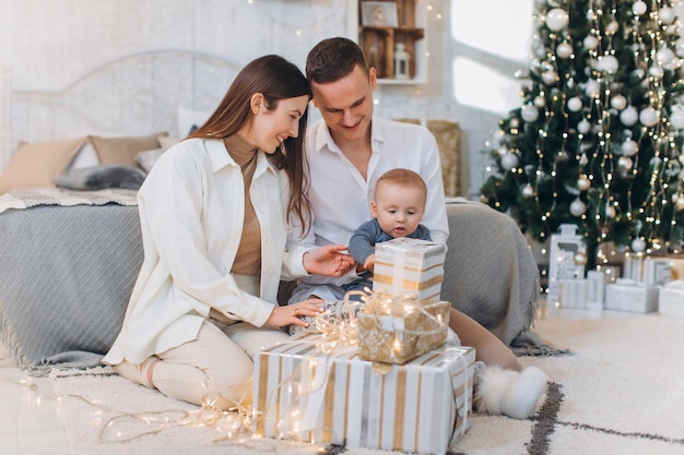 family celebrating new year near tree