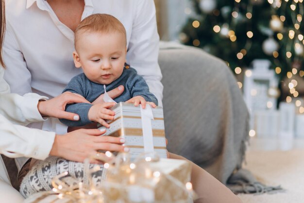 family celebrating new year near tree