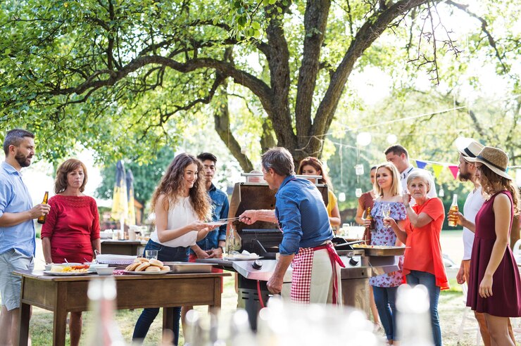 Photo family celebration or a barbecue party outside in the backyard