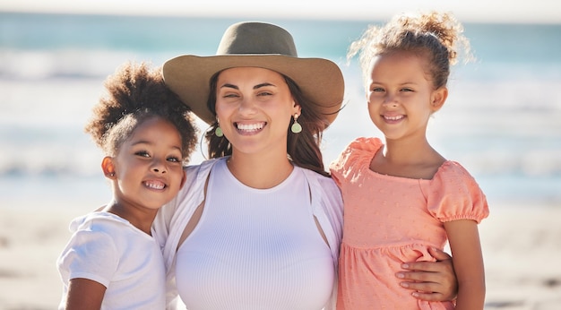 Family children and beach with a girl mother and sister together by the ocean for bonding during summer Nature sea and love with a daughter sibling and parent on vacation or holiday by the water