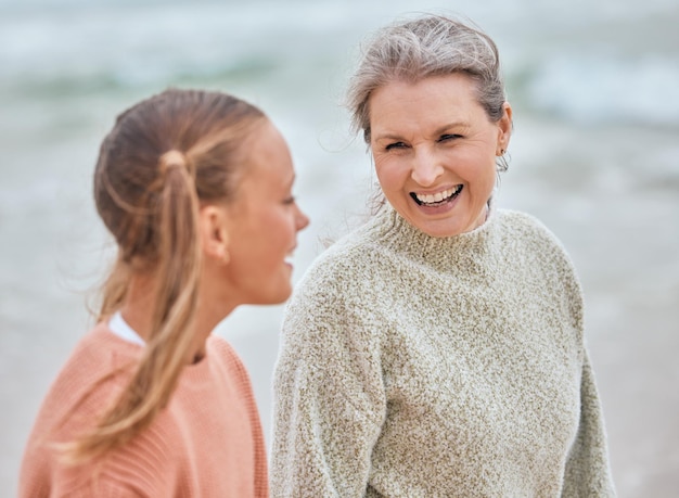 Family children and beach with a senior woman and girl child bonding by the sea in nature Kids love and retirement with a grandmother and grandchild spending time together by the ocean outdoor