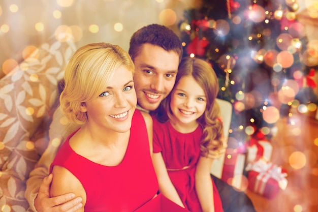 family, christmas, x-mas, winter, happiness and people concept - happy family at home