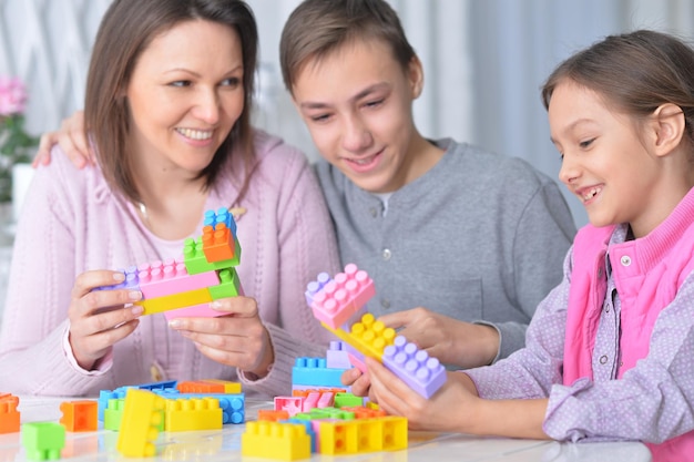 Family collecting blocks together