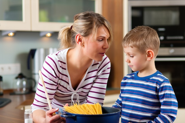 Family cooking in kitchen