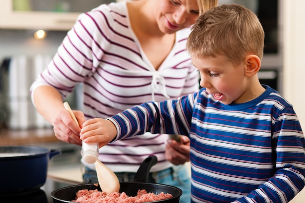 Family cooking in kitchen