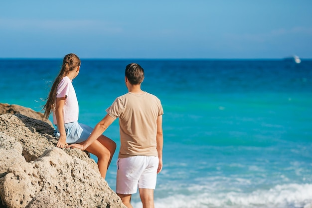 Family of dad and daughter together on the beach