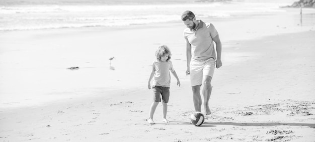 Family of daddy man and child boy playing ball on beach happiness