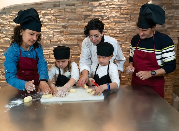 Family doing a cooking workshop with the teacher