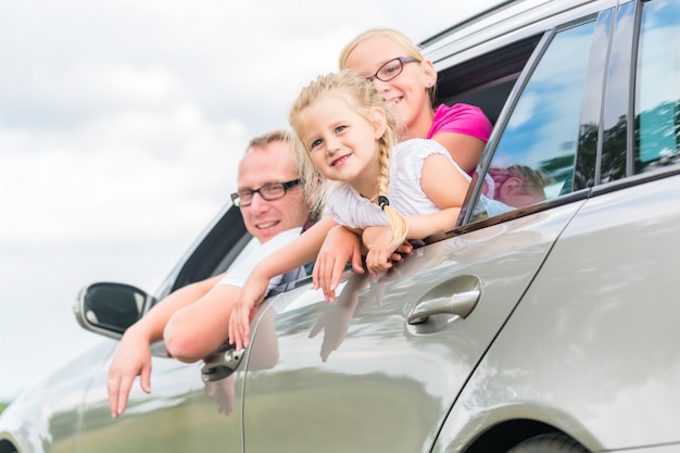 Family driving by car in summer vacation