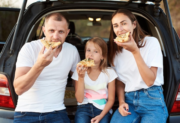 Family eating pizza together