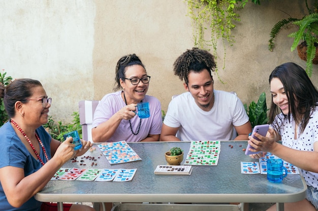 A family enjoys a leisure activity together around a table