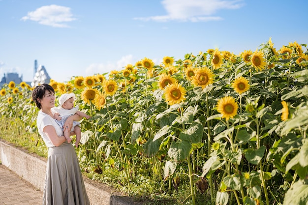 A family in a field of sunflowers