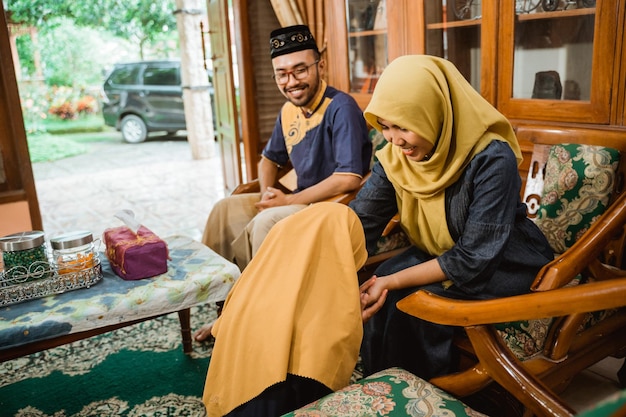 Family forgiving each other and shake their hand on idul fitri