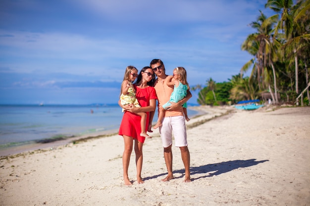 Family of four on beach vacation