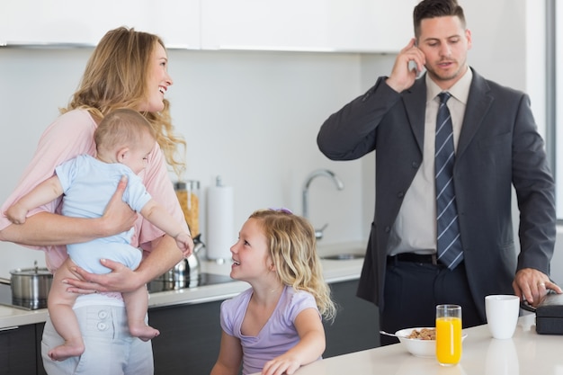 Family of four at breakfast table