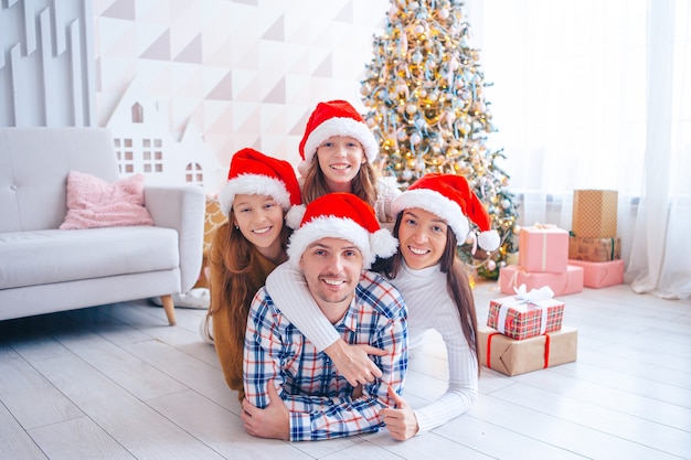 Family of four on Christmas at home